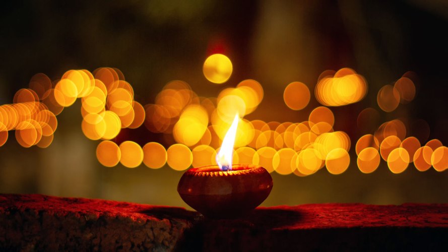 candle for Diwali celebration: interfaith holiday traditions: Faithforce