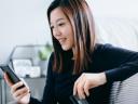 Photo of woman looking at mobile phone: Marketing cloud release