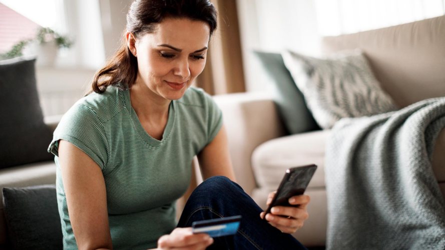 A woman shopping on a device at home: retail predictions