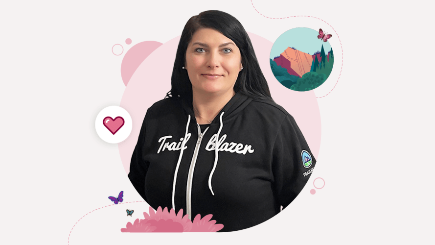 A woman wearing the Salesforce Trailblazer hoodie, perhaps because she's on the customer service career path.