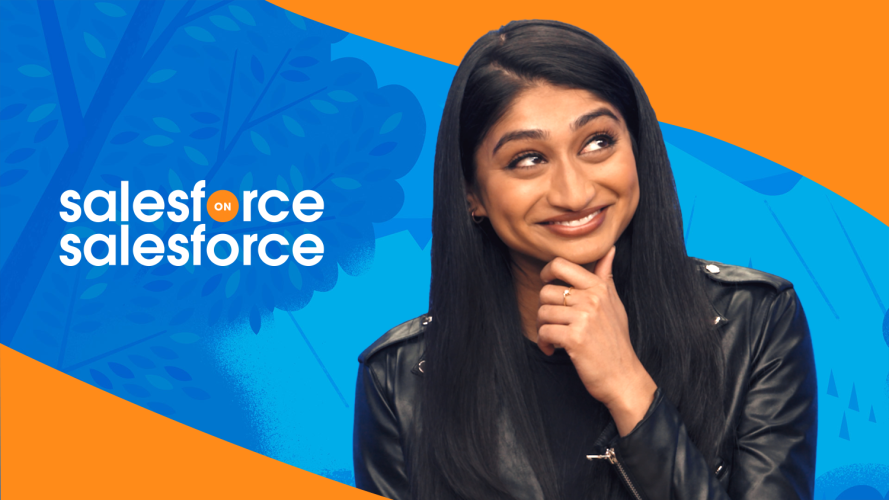 Close-up of woman holding her chin against a blue and orange background. Salesforce on Salesforce tells you how to deliver a successful product launch