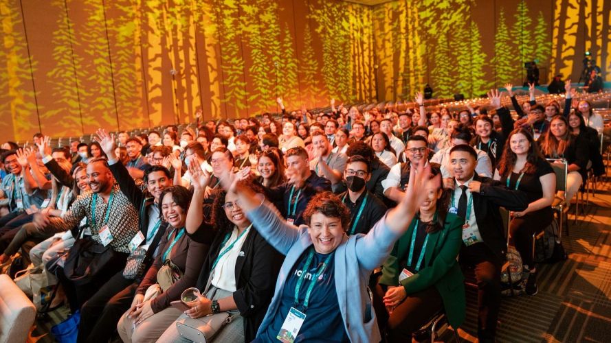 A crowd full of people celebrate in a conference hall at the Moscone Center in San Francisco for Dreamforce / Dreamforce for marketers