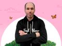 Trailblazer Amnon Kruvi in a Trailblazer hoodie against a pale pink background
