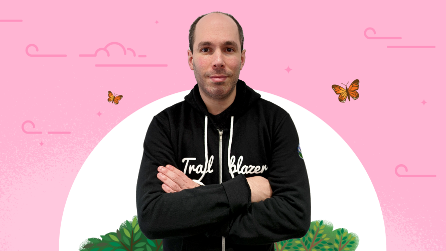 Trailblazer Amnon Kruvi in a Trailblazer hoodie against a pale pink background
