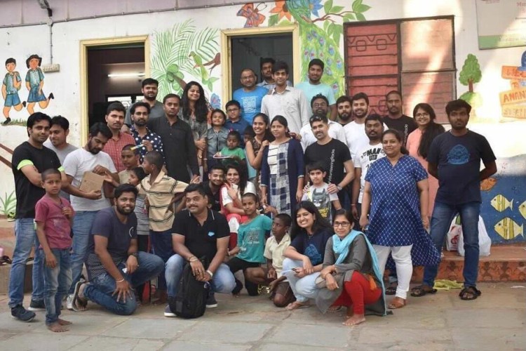 Ankit and his team posing for a photo.