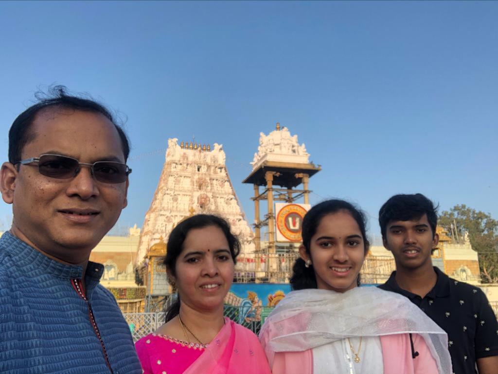 Kusuma smiles with her family.