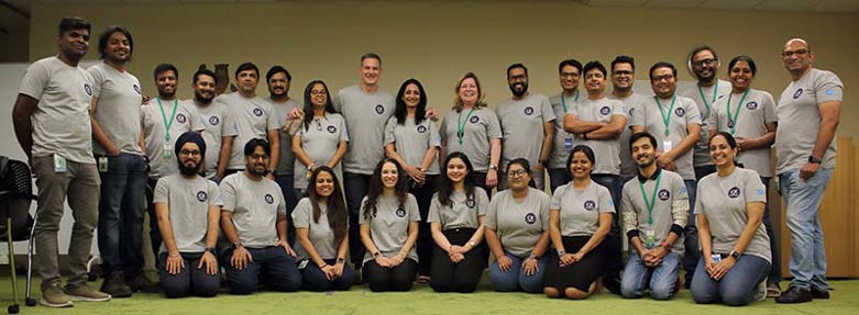 Mousumi with her team members posing for a photo
