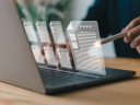 Image of person on laptop and selecting documents / Salesforce is now part of the HITRUST Shared Responsibility and Inheritance program