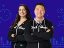 Two Salesforce Platform Developers stand in Trailblazer hoodies