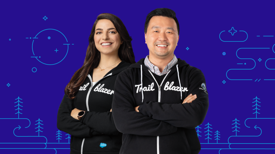 Two Salesforce Platform Developers stand in Trailblazer hoodies