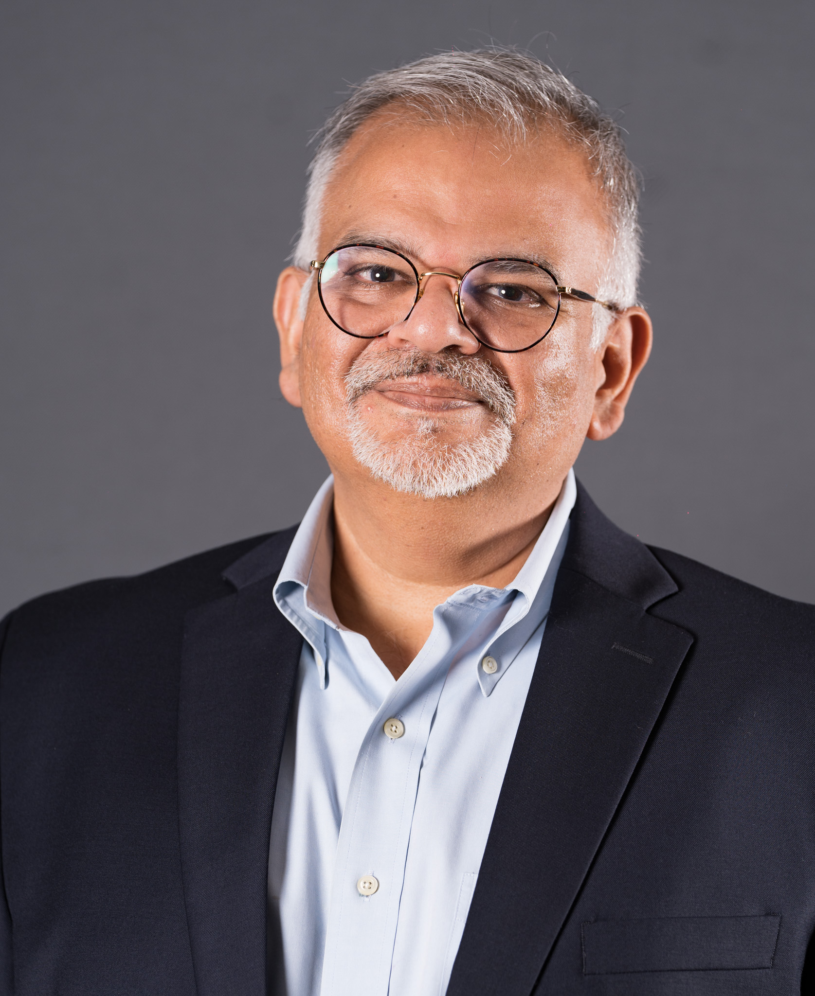 Photo of Sanket professionally dressed and smiling