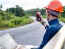 A worker holds a laptop in his lap while conducting a video call: mobile offline access.