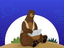 Cody the bear on a laptop.
