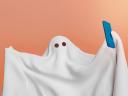 Illustration on a pink background of a ghost holding a phone, taking a selfie / customer engagement strategy