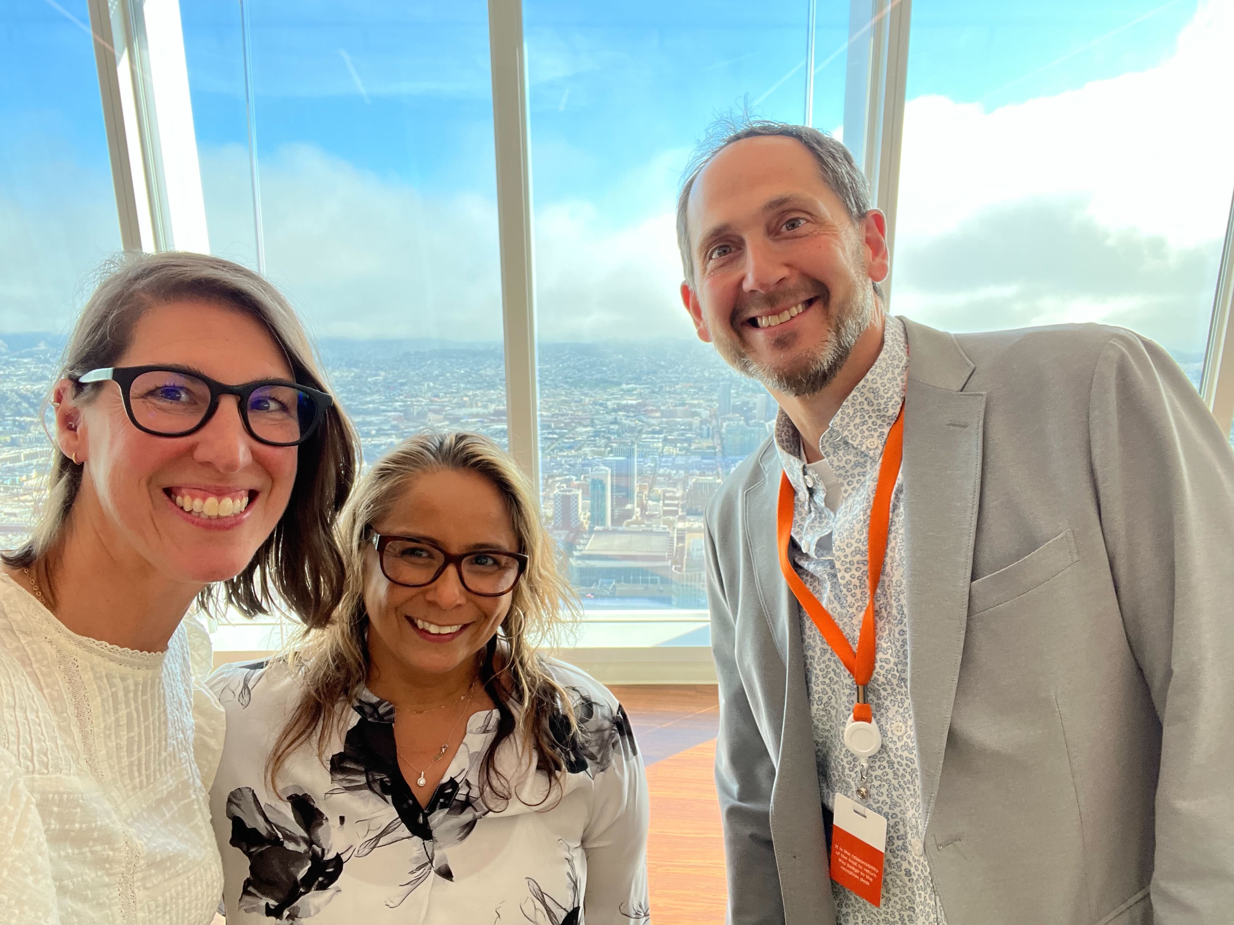 Caren, left, with her customers at an event she co-hosted at Salesforce Tower.