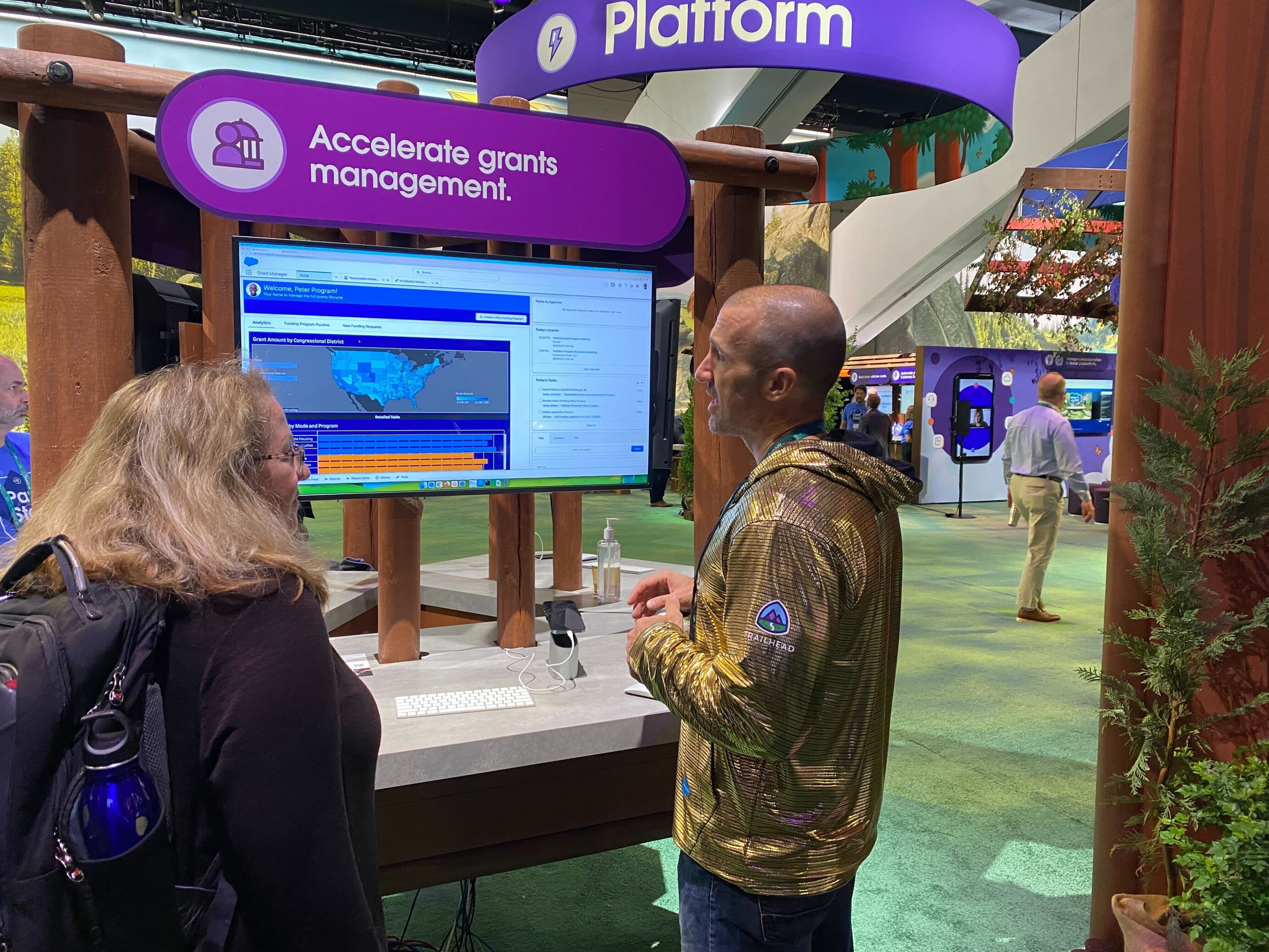 David at Dreamforce 2022 on the expo floor, demoing Salesforce's Grants Management public sector offering to a prospective customer.