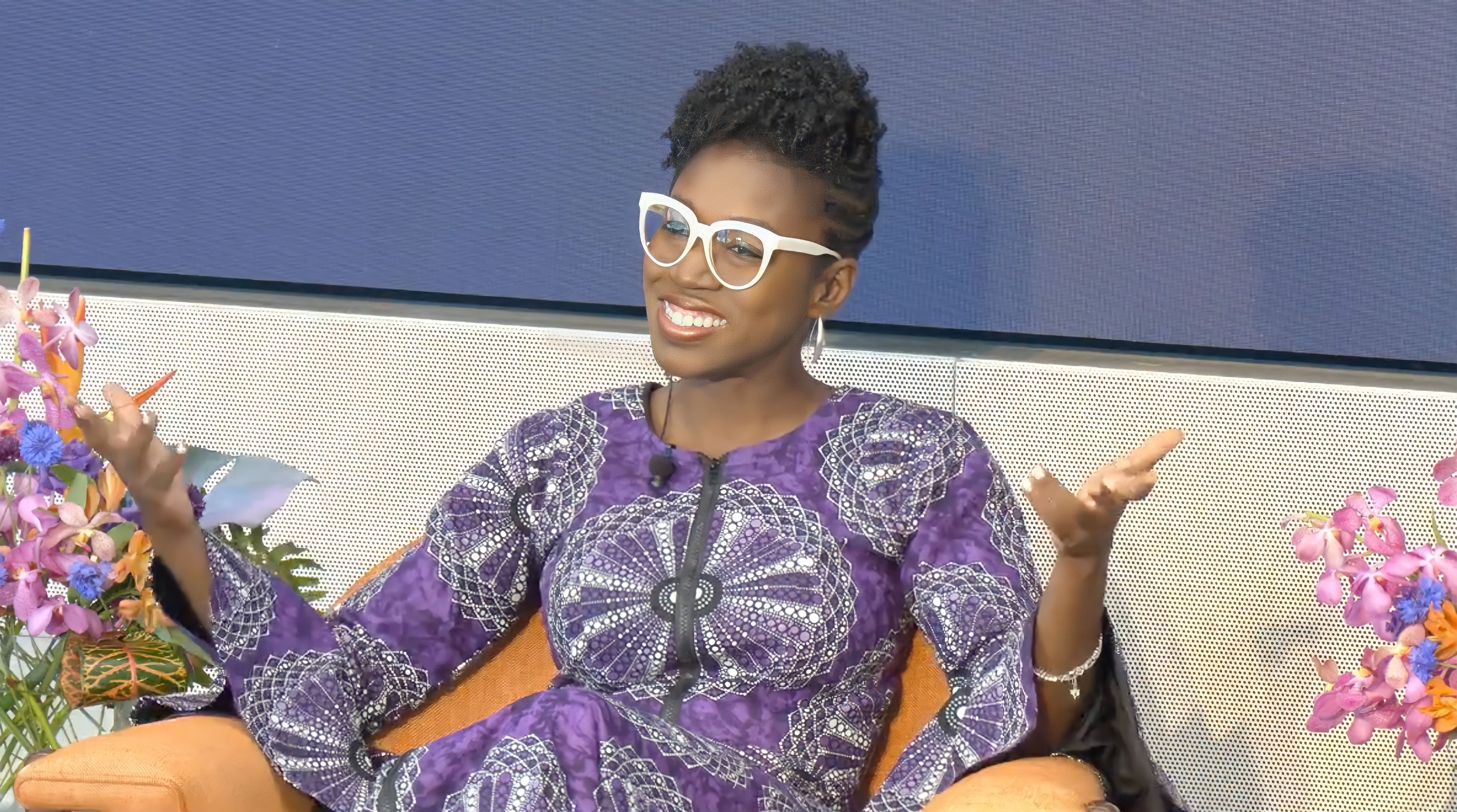 Photo of Joy Buolamwini smiling.