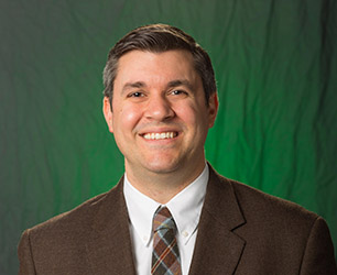 Geoff DeLizzio, Chief Development Officer at the Epilepsy Foundation of America, in front of a green background