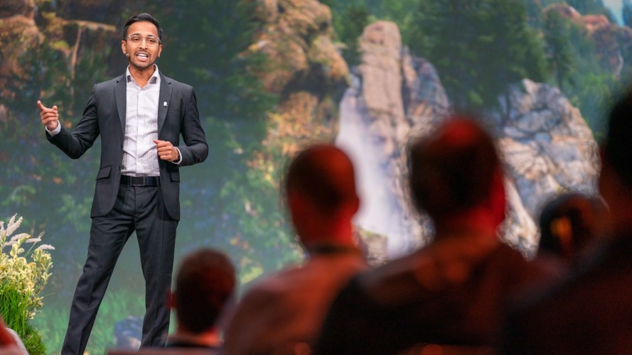 A Dreamforce speaker on the stage: Dreamforce data sessions