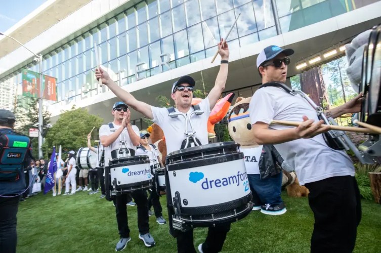 Members of a marching band parading about at Dreamforce.
