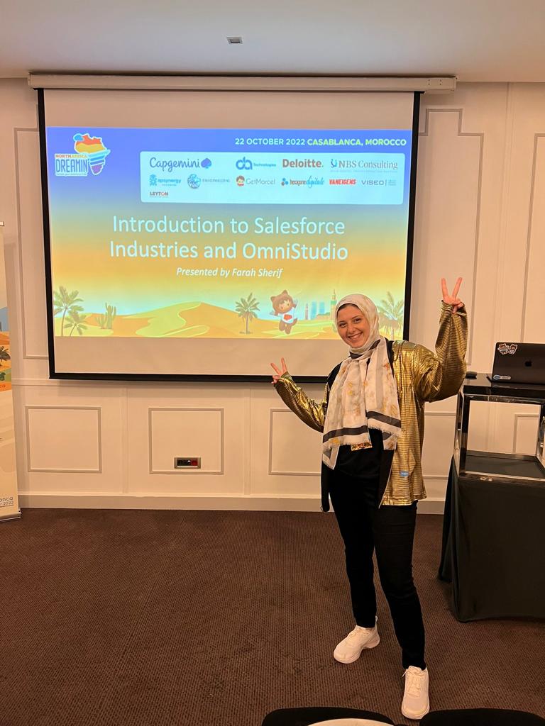 Farah Sherif making peace signs at a Salesforce Developers Community event