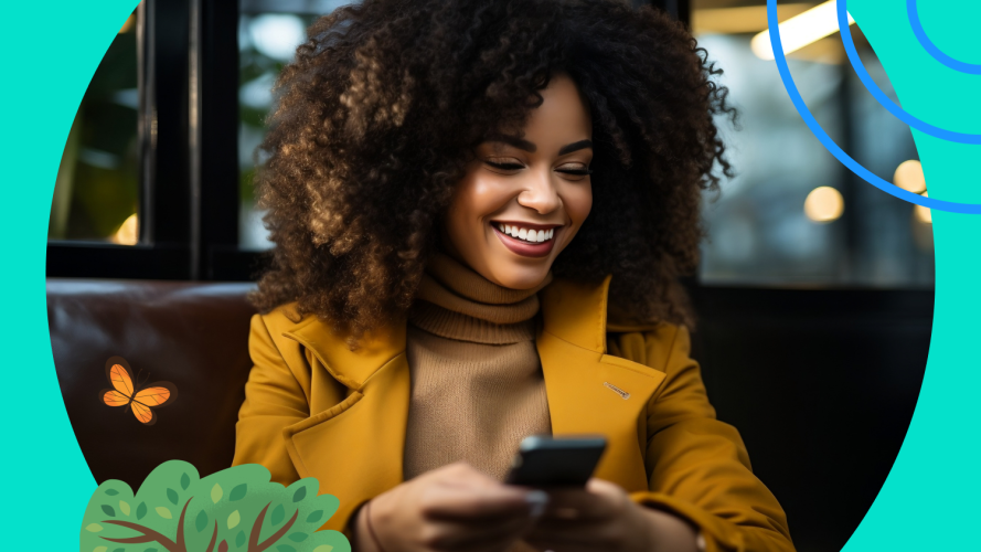 Woman in a jacket checking her phone and smiling / email deliverability