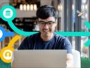 Sales rep looking at a laptop screen: sales tech consolidation