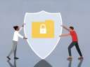 two people holding shield to represent data privacy