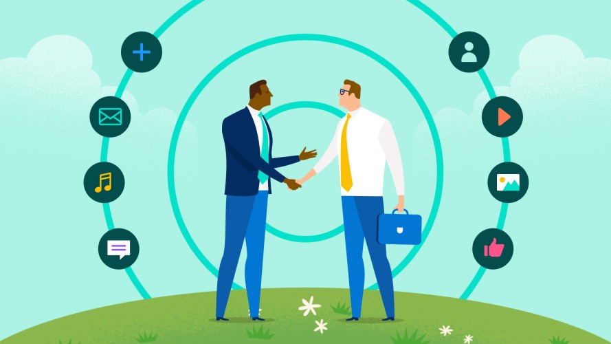 Sales rep shaking hands with a marketing rep: sales and marketing