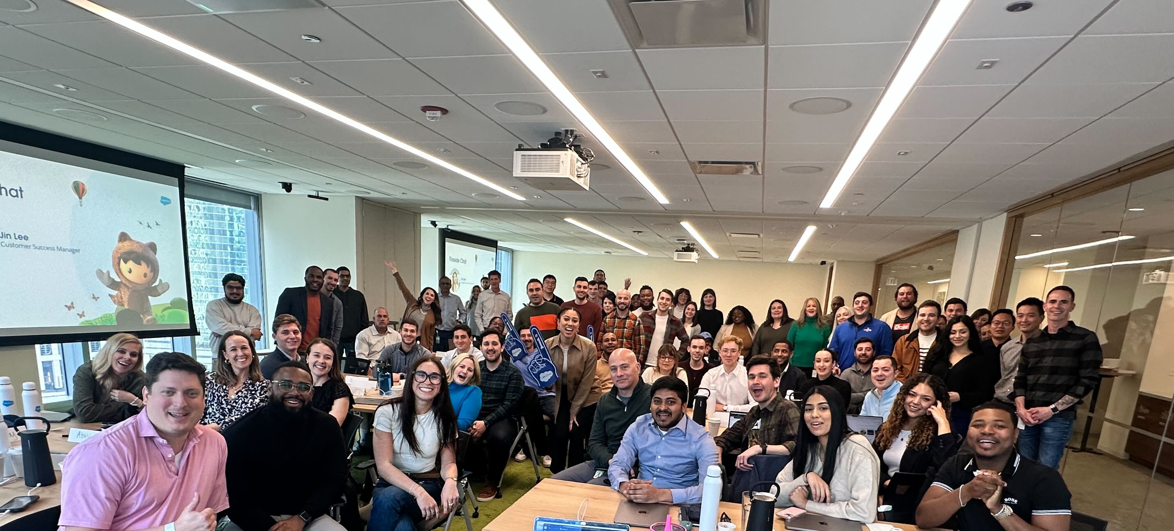 Say "Astro!" A cohort of new Salesforce employees snaps a photo during in-person onboarding in Chicago.