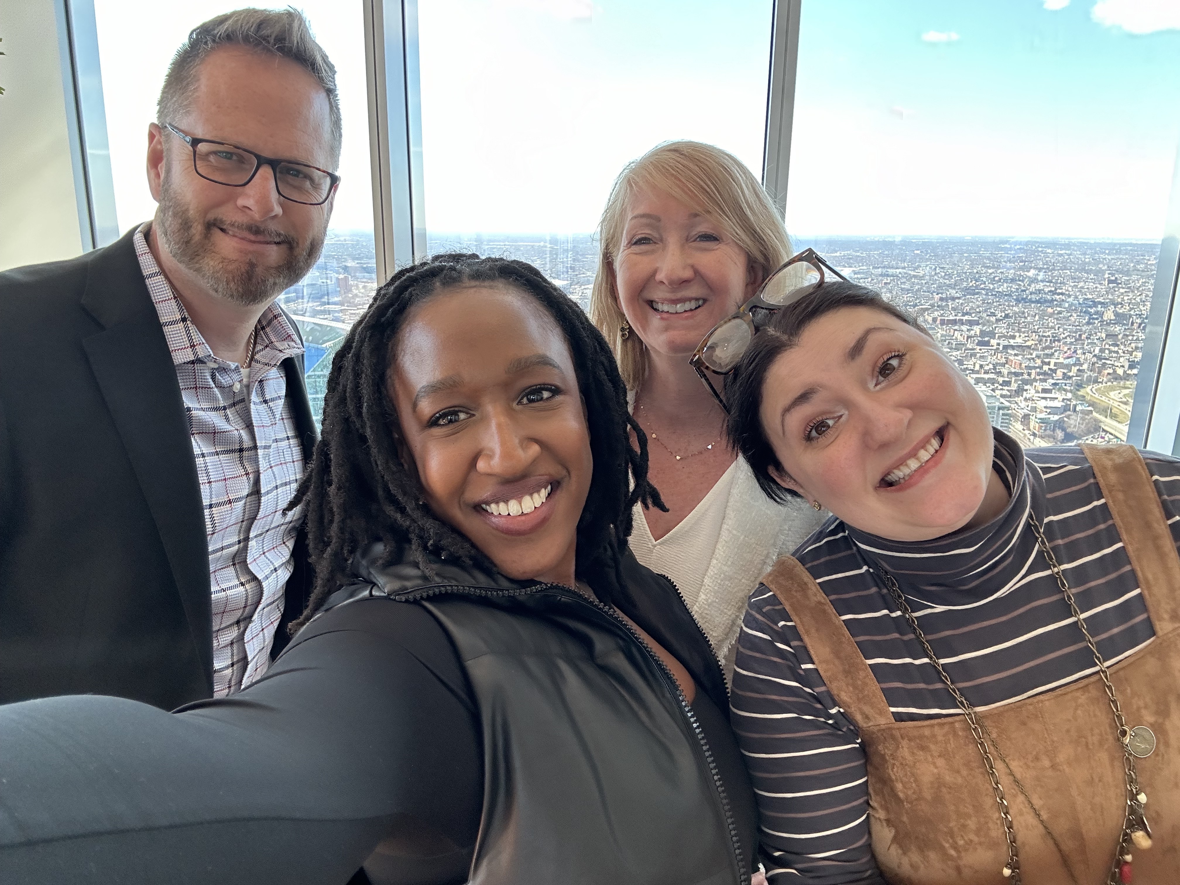 A group of new hires from the Atlanta office- check out those views!