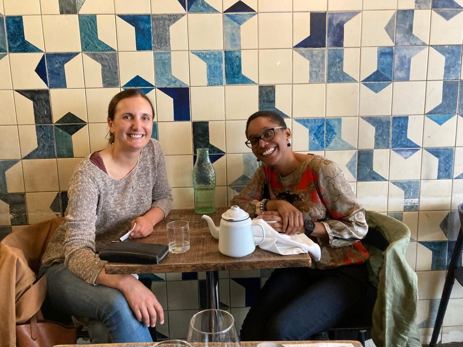Mallaurie (R) and mentee Alexandra, a former professional golfer, share a passion for food and often enjoy dining out together.