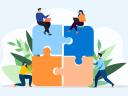 An illustration showing people putting four puzzle pieces together