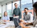 A group of workers in a meeting