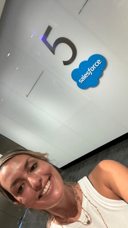 Victoria smiling next to the Salesforce logo 