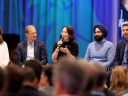 Clara Shih, David Schmaier, Kat Holmes holding a mic and talking, Khushwant Singh, and Param Kahlon. Leaders on stage during True to the Core at Dreamforce 2024.