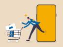 Illustration on a yellow background of a man walking out of his smartphone with a shopping basket full of items