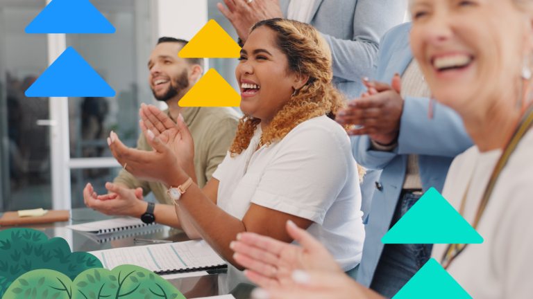 A diverse group of professionals enthusiastically applauding during a sales meeting, embodying sales motivation.