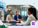 Banking advisor helping a couple with financial services personalization during economic events at a desk in a conference room framed by a flying Agent Einstein character in the top left hand corner and a purple Financial Services icon in the bottom right hand corner.