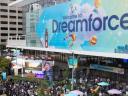 Aerial view of attendees gathered outside the Moscone Center under a Dreamforce conference entrance sign.