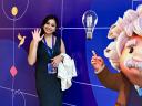Garima poses next to an AI NOW Tour poster featuring Einstein and a purple background