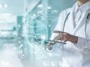 Image of a doctor in a lab coat, holding a tablet, with a graphical overlay of medical symbols