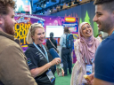 Attendees at Dreamforce sharing a moment of connection for networking small businesses.
