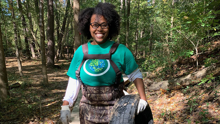Julianne Tajuba volunteering at a forest cleanup event