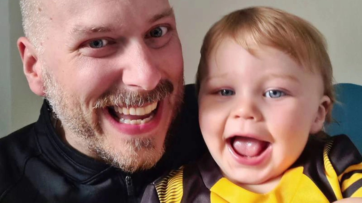 Ken with his son at home