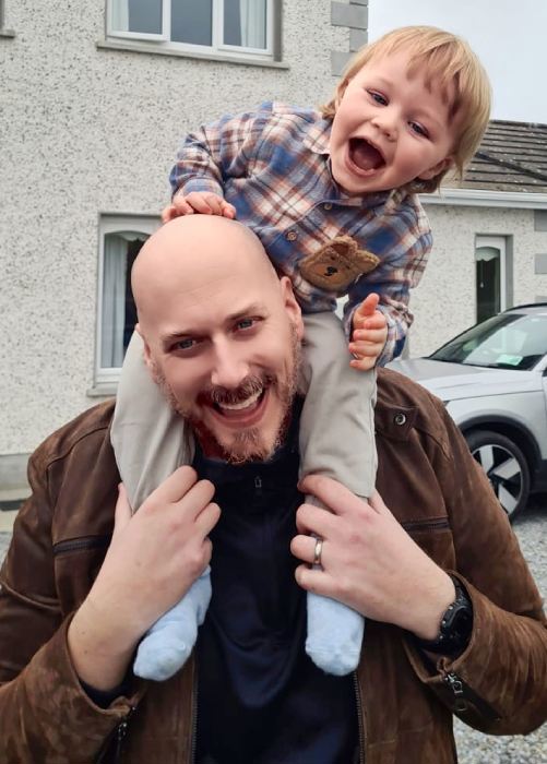 Ken and his son on his shoulders