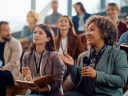 A group of small business owners together in an AI conference amphitheater.