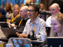 Attendees watch a session at Dreamforce.