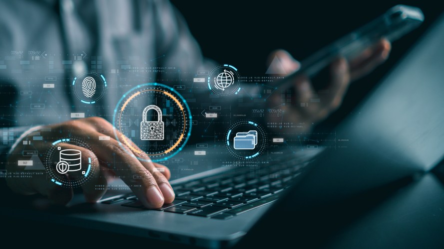 graphic of a hand on the keyboard with security and development icons