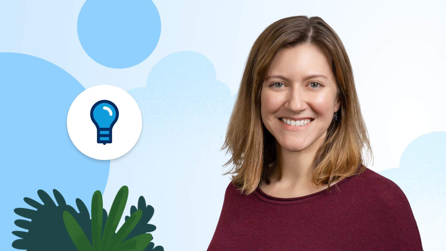 Woman in a red shirt in front of a blue background.